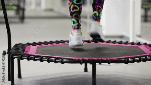 jumping fitness, skyjumping, sky jumping, big jumping, beautiful young girls doing jumping fitness. fitness on trampolines, young girls perform various exercises for a beautiful figure. Build body. photo