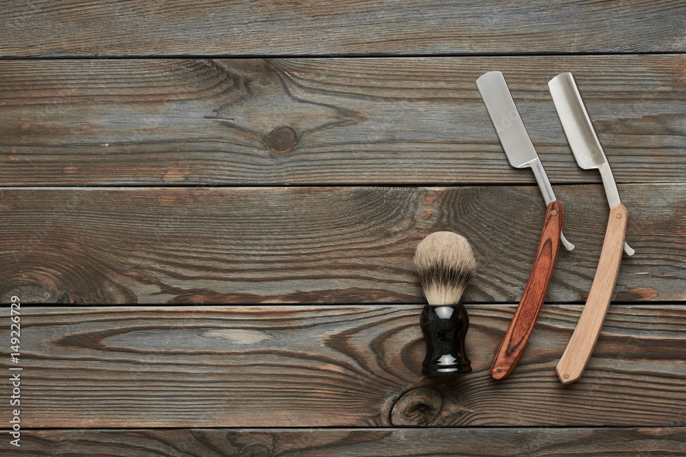 Vintage barber shop tools on wooden background