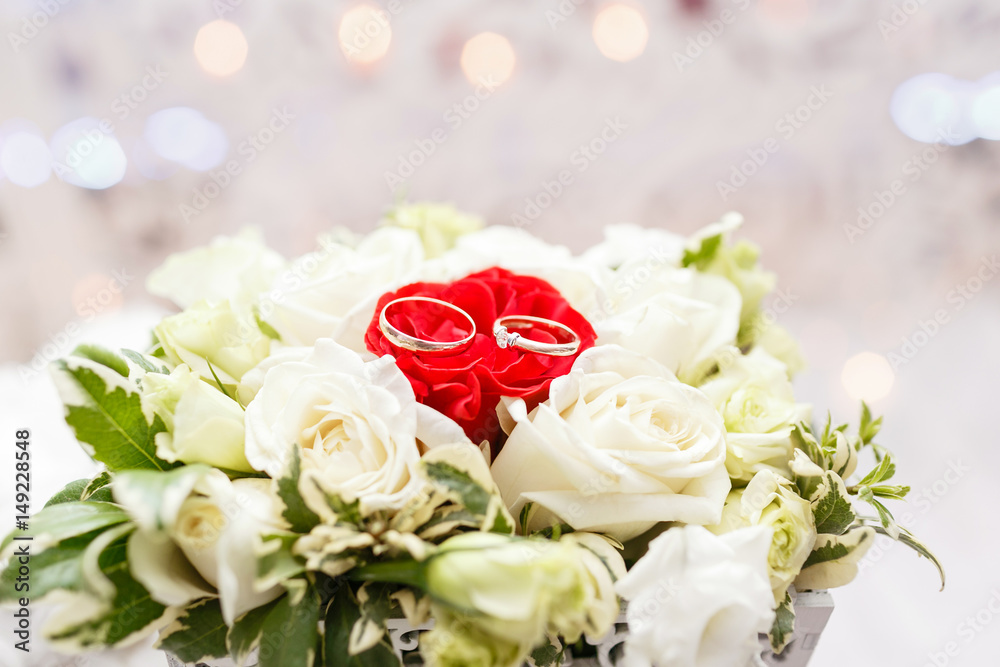 Set of wedding rings in Red and white rose taken closeup. wedding concept. selective focus Set of wedding rings in Red and white rose taken closeup. wedding concept. selective focus
