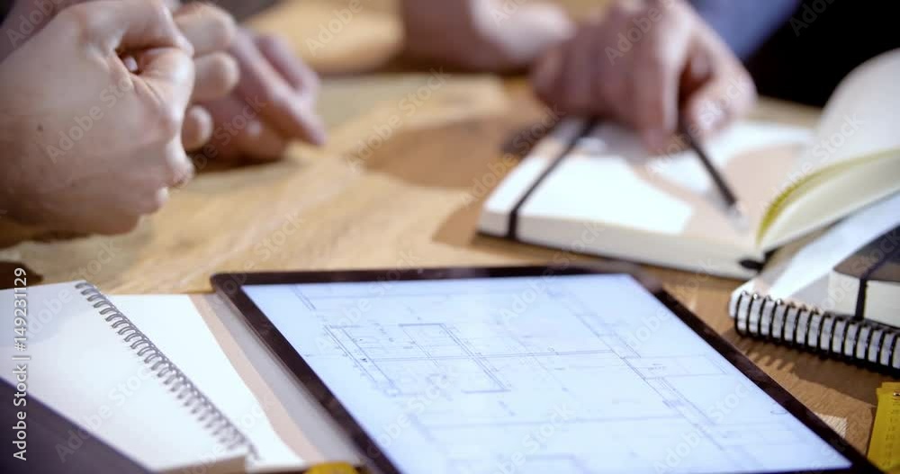 Creative business team work meeting an at agency office. details on hands working on design project idea on tablet. 4k indoor technology video Creative business team work meeting an at agency office. details on hands working on design project idea on tablet. 4k indoor technology video