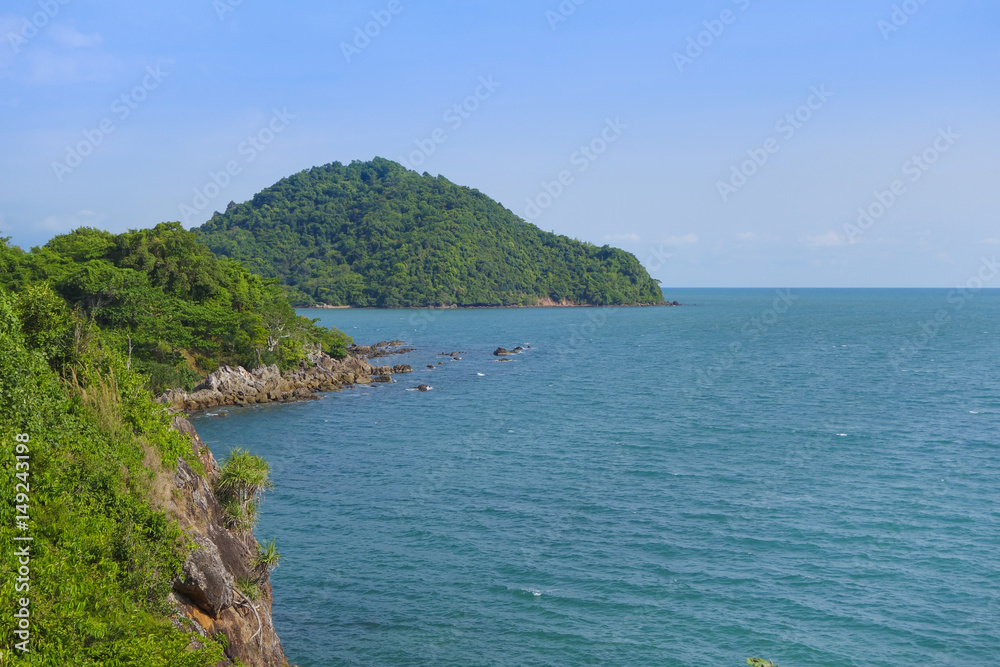 Beautiful aerial view point of tropical sea bay and island, with mountain cliff and rocks in foreground, Noen Nangphaya View Point at Chalerm Burapha Chonlathit Highway, Chanthaburi, Thailand.