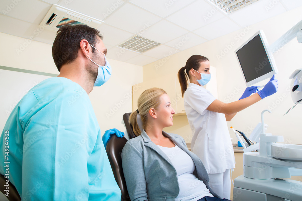 Adult woman getting her checkup at the Dentist Adult woman getting her checkup at the Dentist