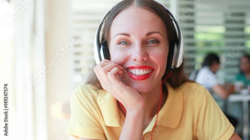 pretty female customer care representative. Woman wearing earphones