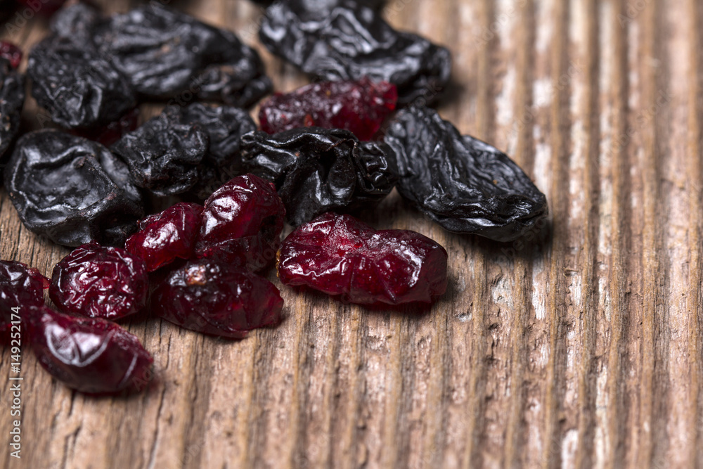 Dried Black and Red berries on wooden background Dried Black and Red berries on wooden background