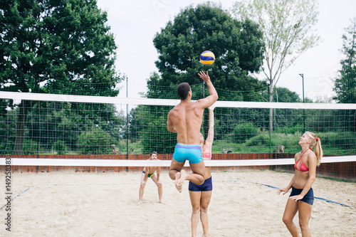 Fototapeta Naklejka Na Ścianę i Meble -  Beach volleyball, people outdoors. 