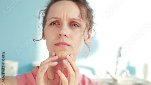 woman is checking her skin