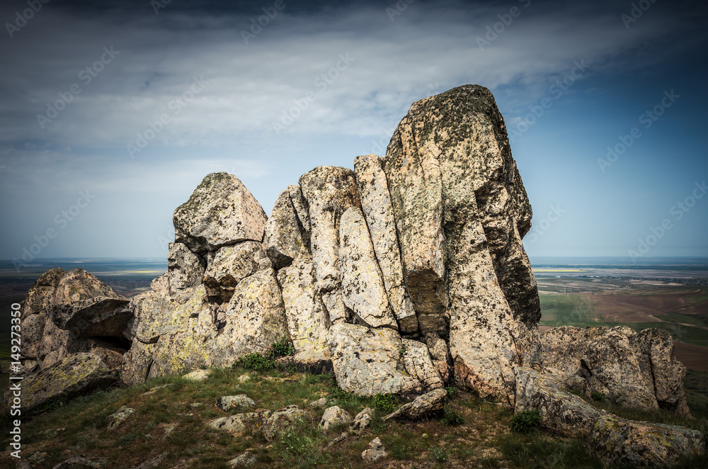 Rocks formations in Dobrogea, Tulcea county, Romania. Naturally formed piles of large rocks in Macin Mountain the olders alps in Europe