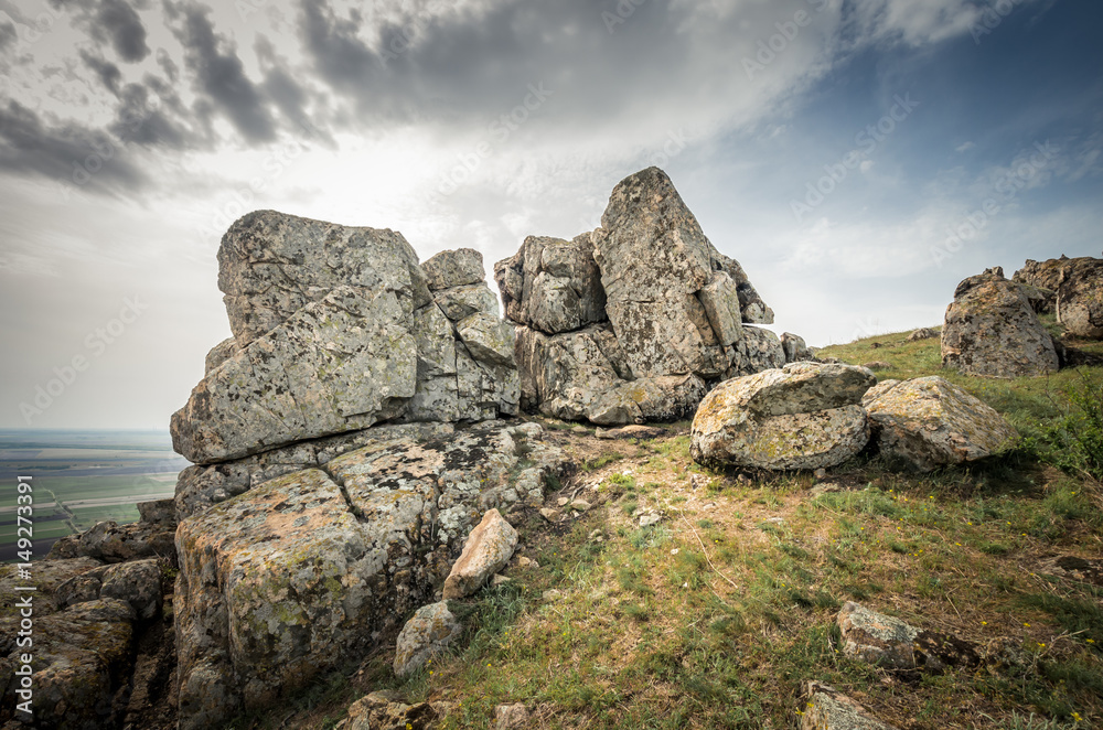 Rocks formations in Dobrogea, Tulcea county, Romania. Naturally formed piles of large rocks in Macin Mountain the olders alps in Europe Rocks formations in Dobrogea, Tulcea county, Romania. Naturally formed piles of large rocks in Macin Mountain the olders alps in Europe