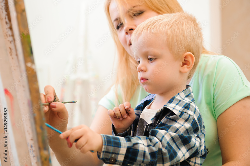 Mother and child draw a picture paints, art lesson Mother and child draw a picture paints, art lesson