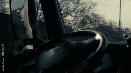 View in tank car's rearview mirror on highway