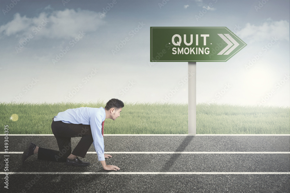 Male entrepreneur ready run near a signpost Male entrepreneur ready run near a signpost