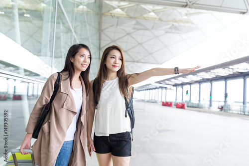 Friends asking for taxi in Hong Kong airport