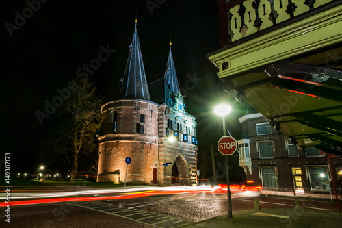 Atmospheric night photo of the old City gate Cellebroederspoort  in Kampen, Netherlands photo
