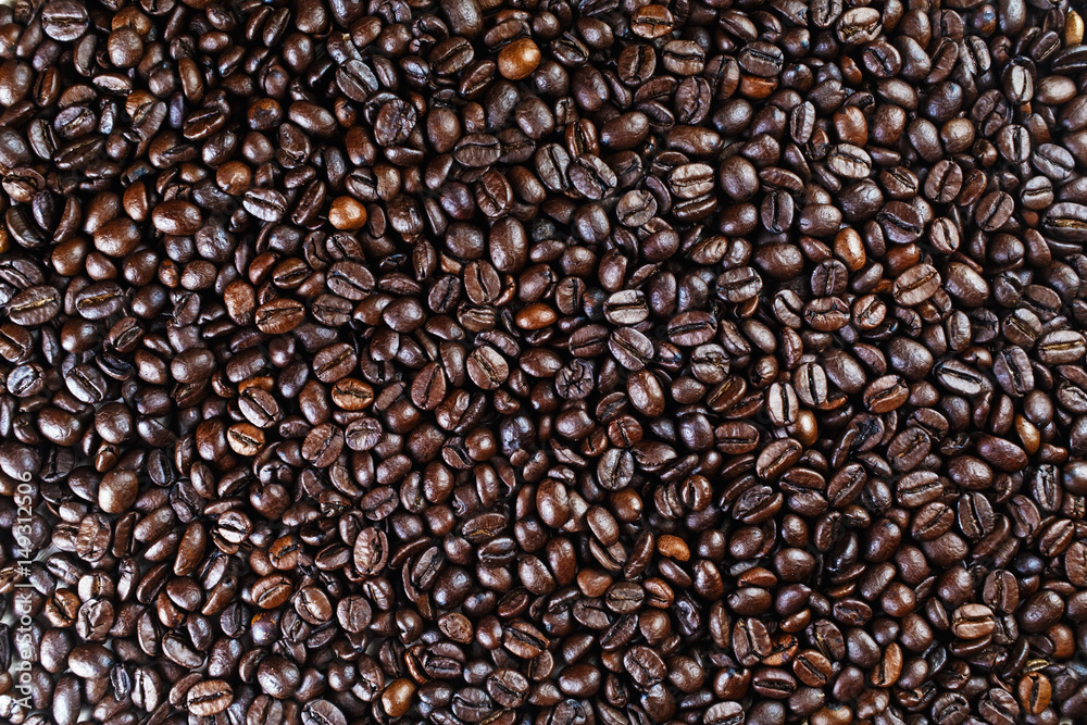 Roasted coffee beans background. Brown coffee beans texture.Top view
