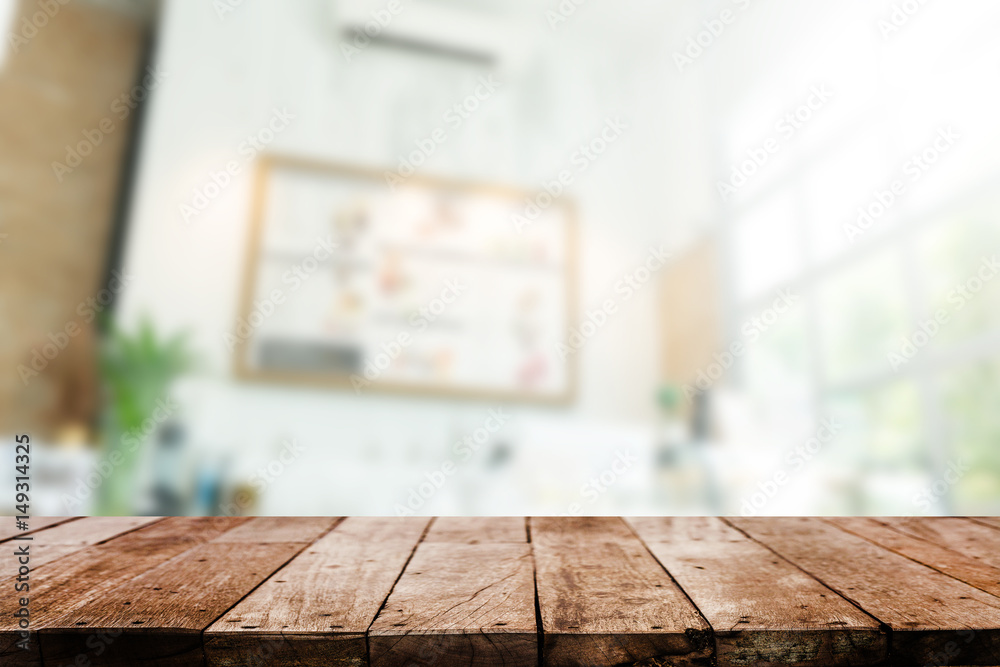 Wood table top with coffee shop blurred background Wood table top with coffee shop blurred background