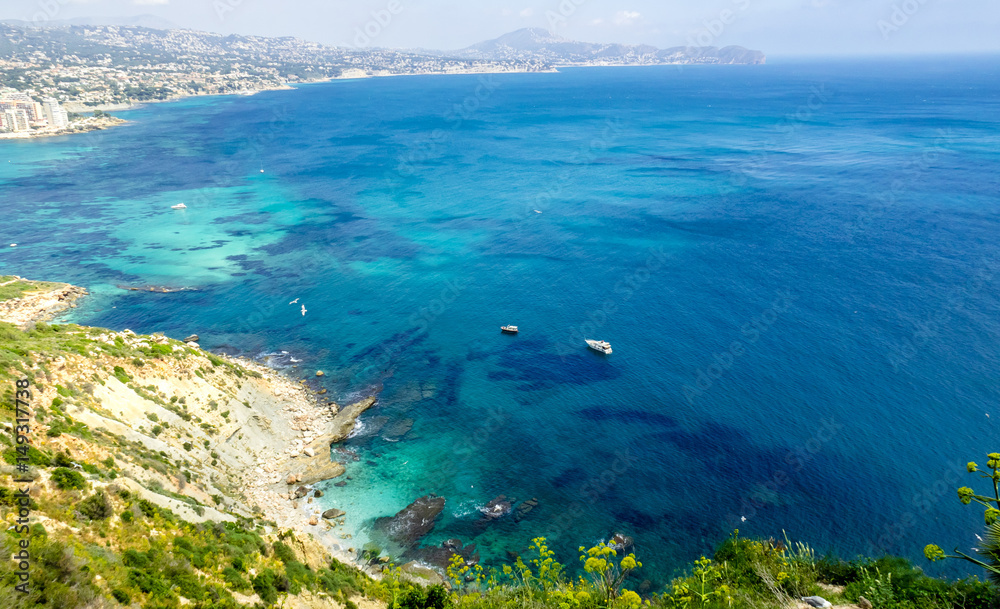 Panoramic landscape of Calpe. Ascension and hiking in the Rock of Ifach. Vacation and sunshine tourism on the beaches of Alicante, Spain. Panoramic landscape of Calpe. Ascension and hiking in the Rock of Ifach. Vacation and sunshine tourism on the beaches of Alicante, Spain.