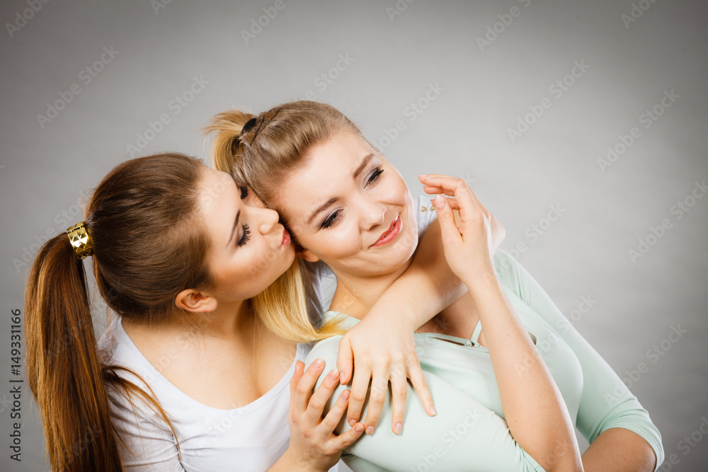 Woman hugging her sad female friend Woman hugging her sad female friend