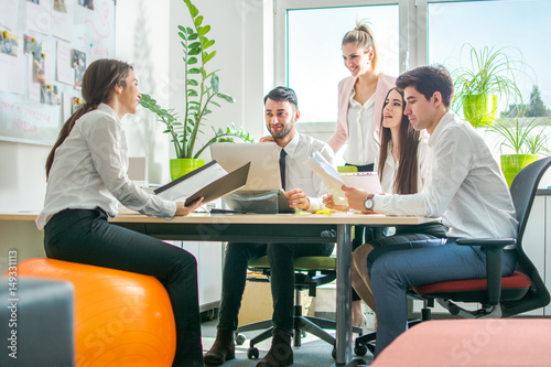 Group of business people having meeting together in the office.