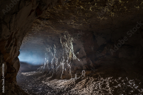 Fotografering A ray of light in the cave