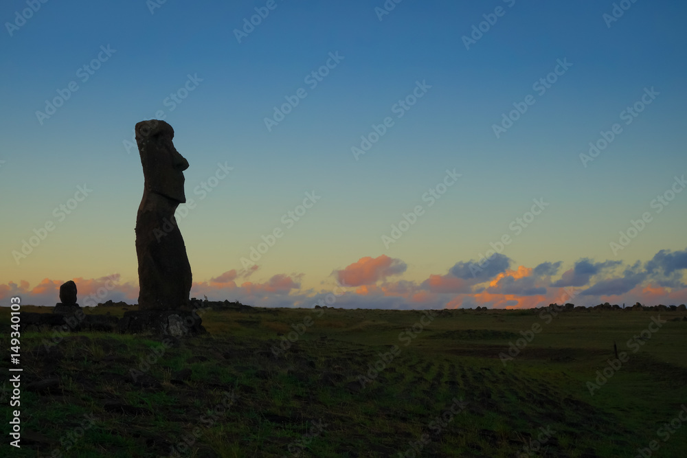 Moai statue ahu akapu at sunset, easter island