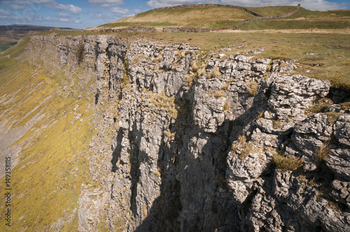 Oxnop Scar, a limestone scar in Swaledale in the Yorkshire Dales National Park, England photo