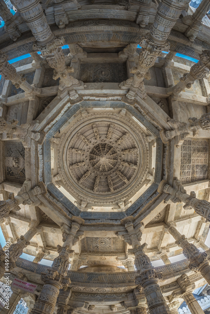 Interior of the majestic jainist temple at Ranakpur, Rajasthan, India. Architectural details of stone carvings.
