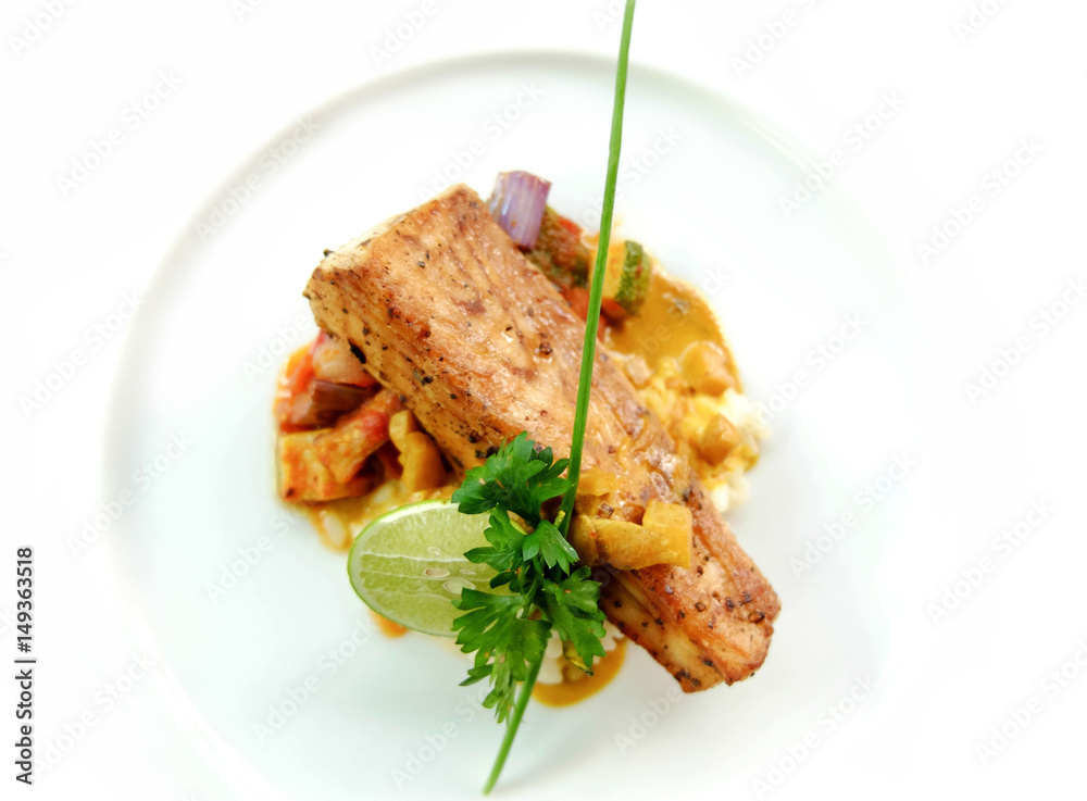 seared fish with risotto on white plate seared fish with risotto on white plate