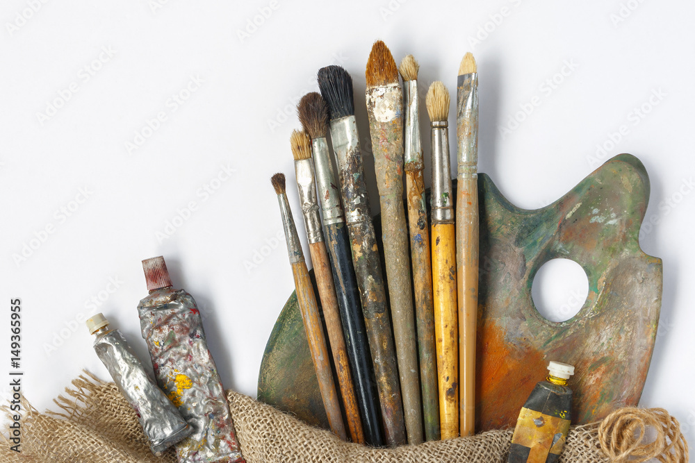 Fototapeta premium Brushes, palette and tubes with paint