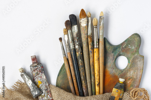 Brushes, palette and tubes with paint