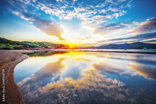 Early morning, sunrise over sea. Greece, Aegean sea. Tranquility seashore nature background.