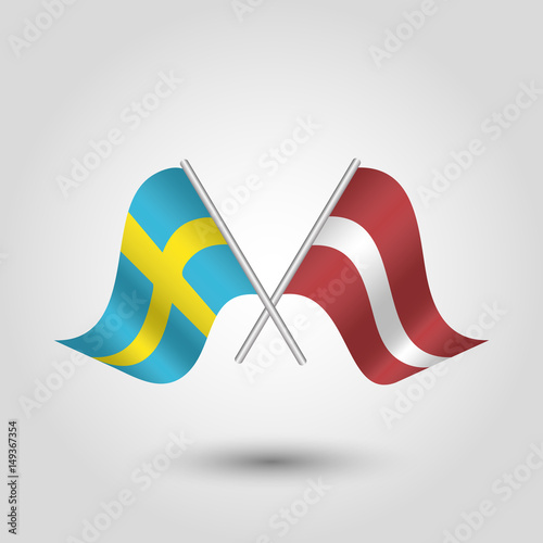 vector two crossed swedish and latvian flags on silver sticks - symbol of sweden and latvia