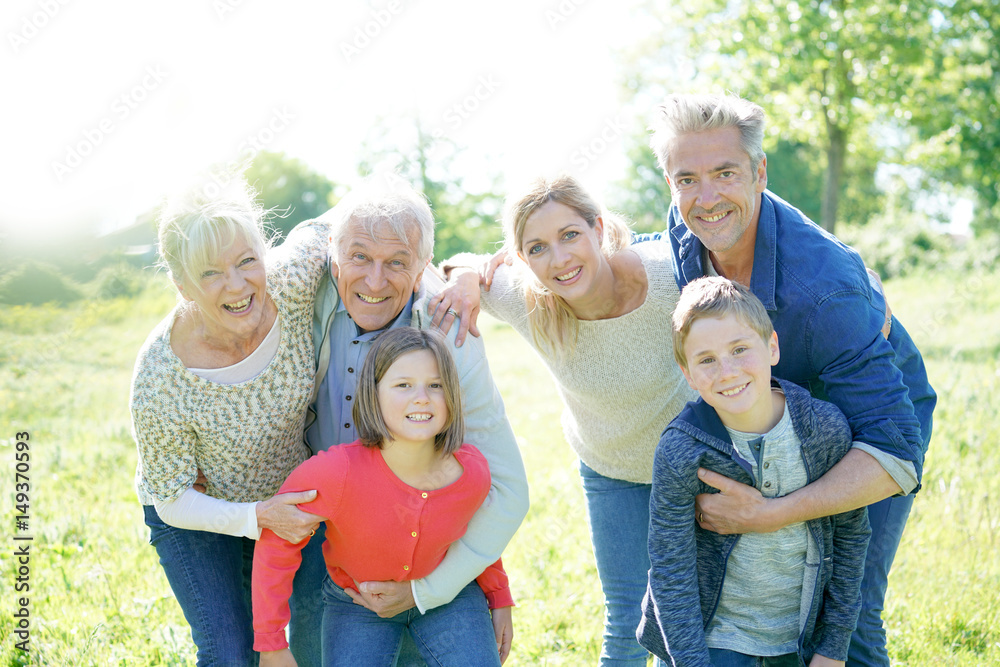 Intergenerational family walking together in park