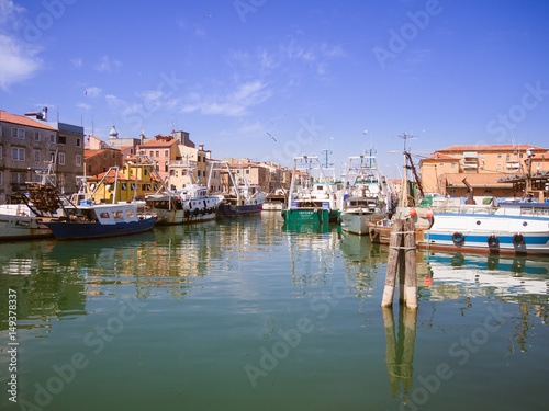 Fishing boats moored in a canal in Chioggia  Italy.