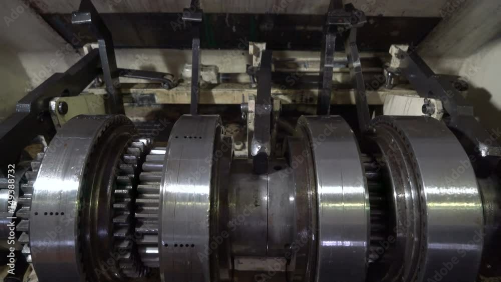 The worker adjusts the machine. Repair transmission unit. The worker adjusts the machine. Repair transmission unit.