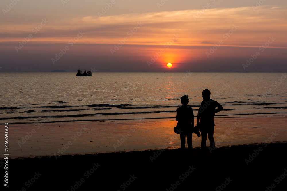silhouette of couple and sunset