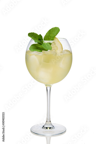 Lemon cocktail with a sparkling wine with ice cubes in wine glass isolated on white