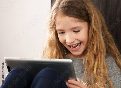 Child playing at tablet