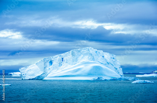 The shapes of icebergs drifting in Paradise Bay  Antarctica  are carved by the sea and winds.