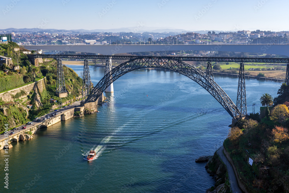 Douro River view with old railway bridge of Maria Pia connected cities of Porto and Vila Nova de Gaia (R), Portugal