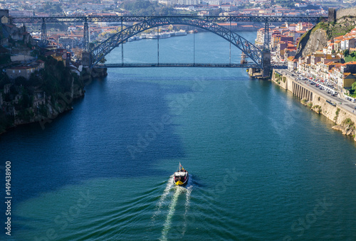 Douro River view with famous bridge of Dom Luis I connected cities of Porto and Vila Nova de Gaia (left), Portugal