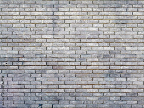 old brick wall with repeating pattern
