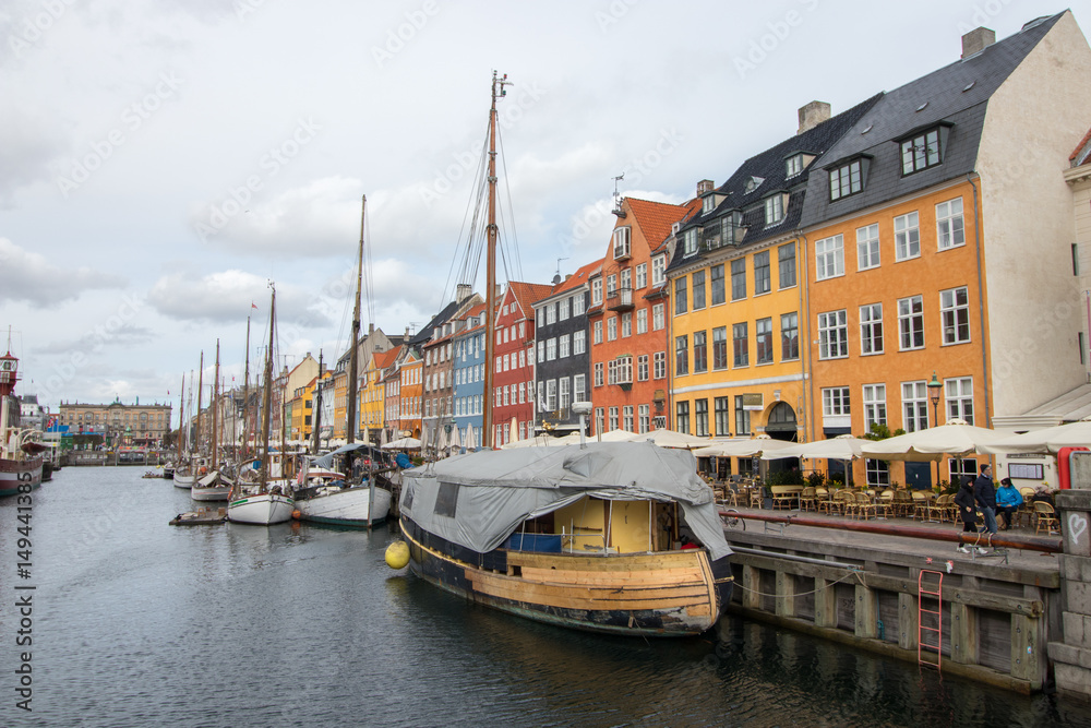 Obraz premium Nyhavn district in Copenhagen, the capital of Denmark. Nyhavn is a 17th-century waterfront, canal and entertainment district.