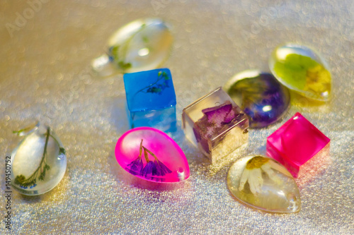 crystals made of epoxy resin with glitters and flowers