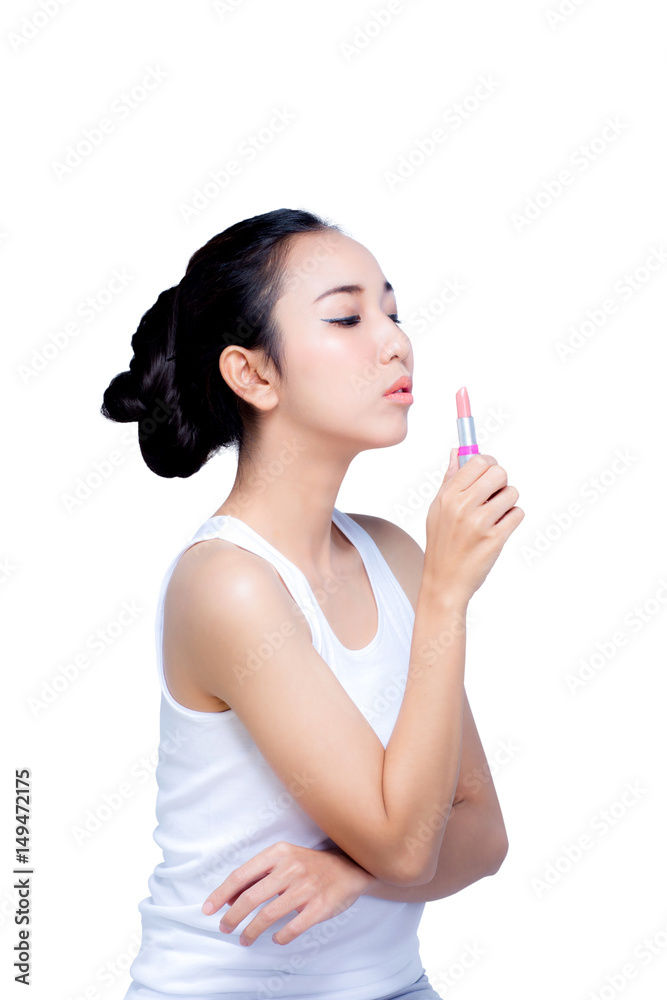 attractive young woman applying pink glossy lipstick isolated on white background attractive young woman applying pink glossy lipstick isolated on white background