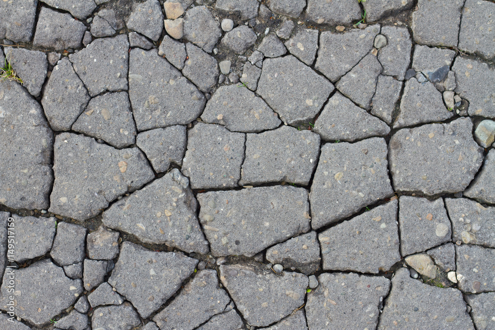 Cracked asphalt road surface texture. Grey texture of the road. Cracked asphalt road surface texture. Grey texture of the road.