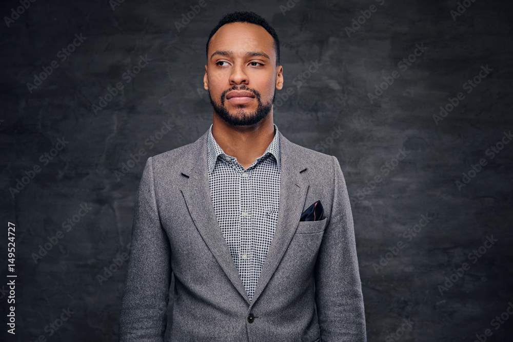 Obraz premium Classic studio portrait of black male dressed in a suit.