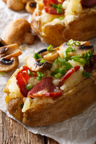 Potato baked with bacon, mushrooms and cheese macro. vertical