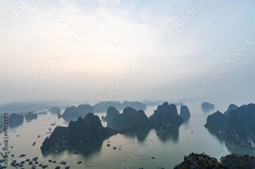 Karst landforms in the sea at the sunrise landscape view from Bai Tho Mountain in Halong Bay, Vietnam, Southeast Asia. UNESCO World Heritage Site © andrii_lutsyk