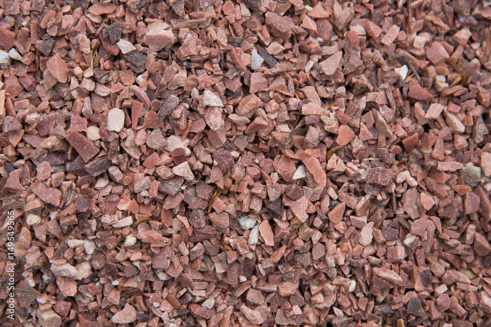 Concrete wall with brick-red pebbles Concrete wall with brick-red pebbles