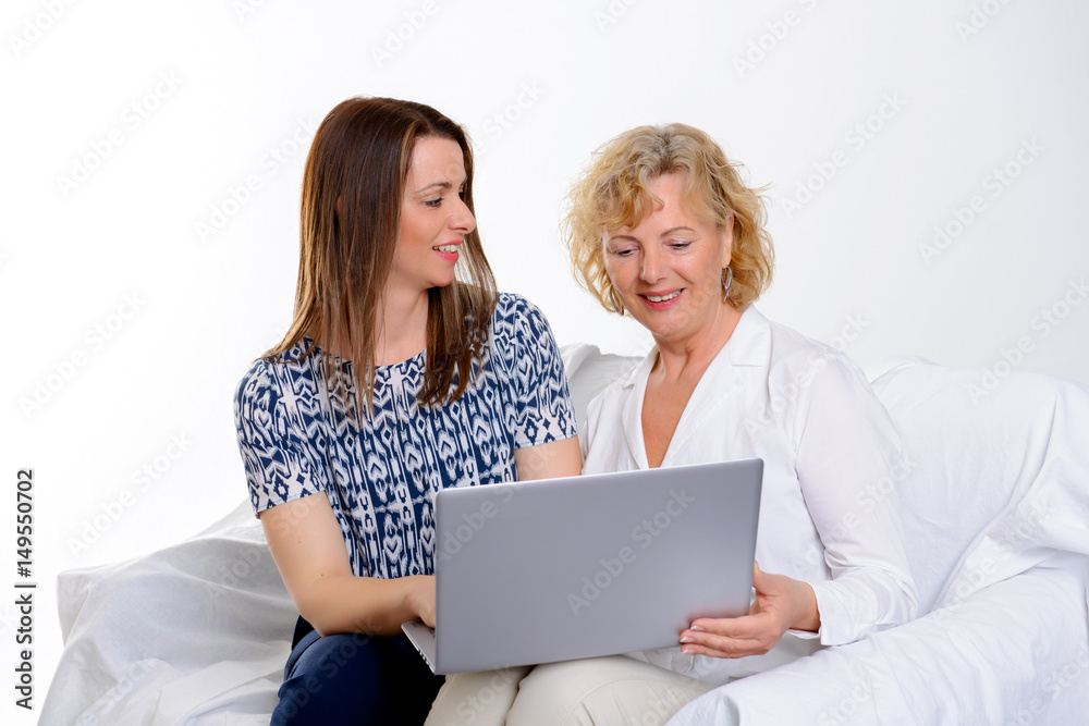 young woman and her mother with laptop